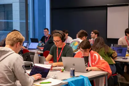 Participants working at laptops during the 24-hour hackathon